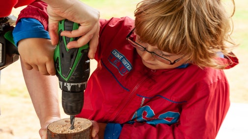 Child helping rangers at Barrington Court